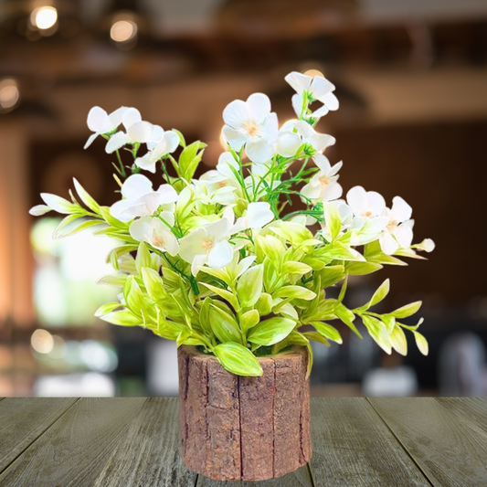 Artificial flower arrangement in a wooden pot on a wooden table with a blurred background