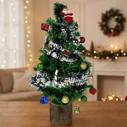 Dekorly Decorated Christmas tree with ornaments on a wooden table, festive background