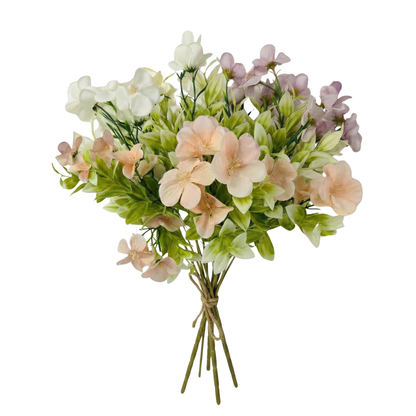 Bouquet of artificial flowers in pastel colors on a white background